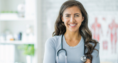 A doctor smiling and looking happy