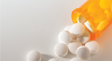 An open bottle of prescription medications.