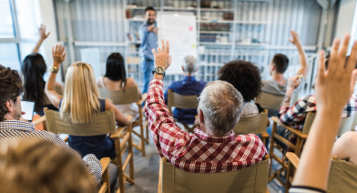 A workshop group asking questions
